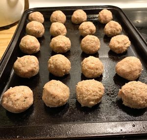 chicken meatballs that will be cooked in a buffalo apricot sauce