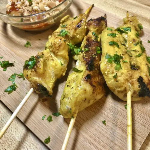 chicken satay skewers with peanut sauce on side