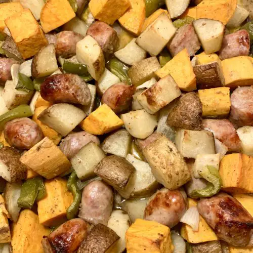 roasted sausage pepper and onion with russet and sweet potatoes on a sheet pan